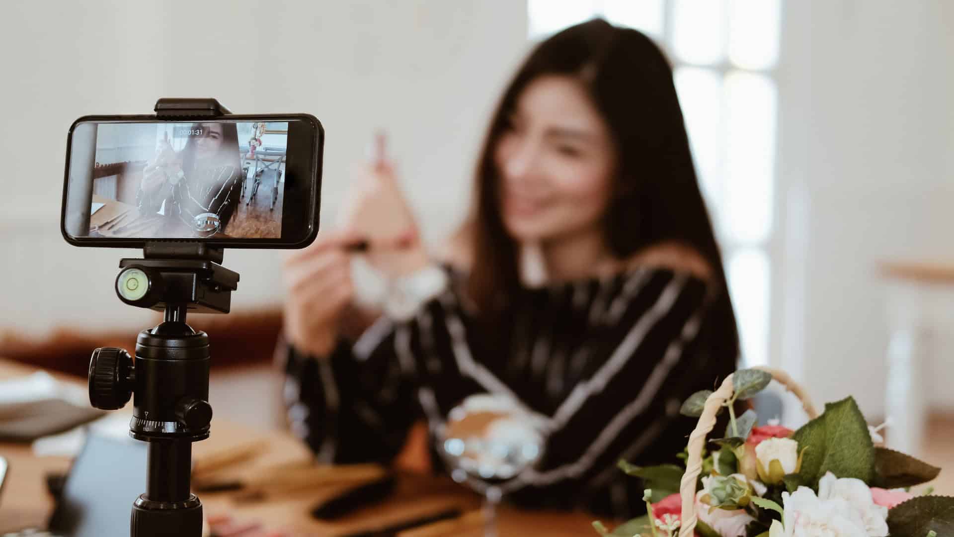 Content creator filming a video for her online community